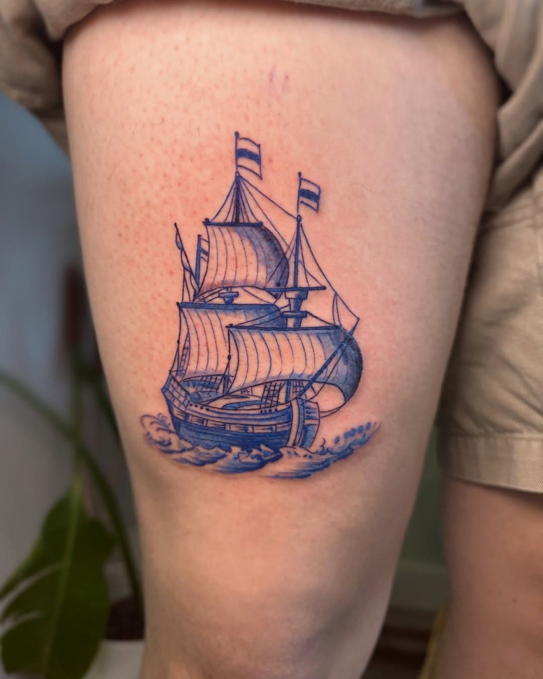 Delft Blue realism tattoo, sailing ship upper arm