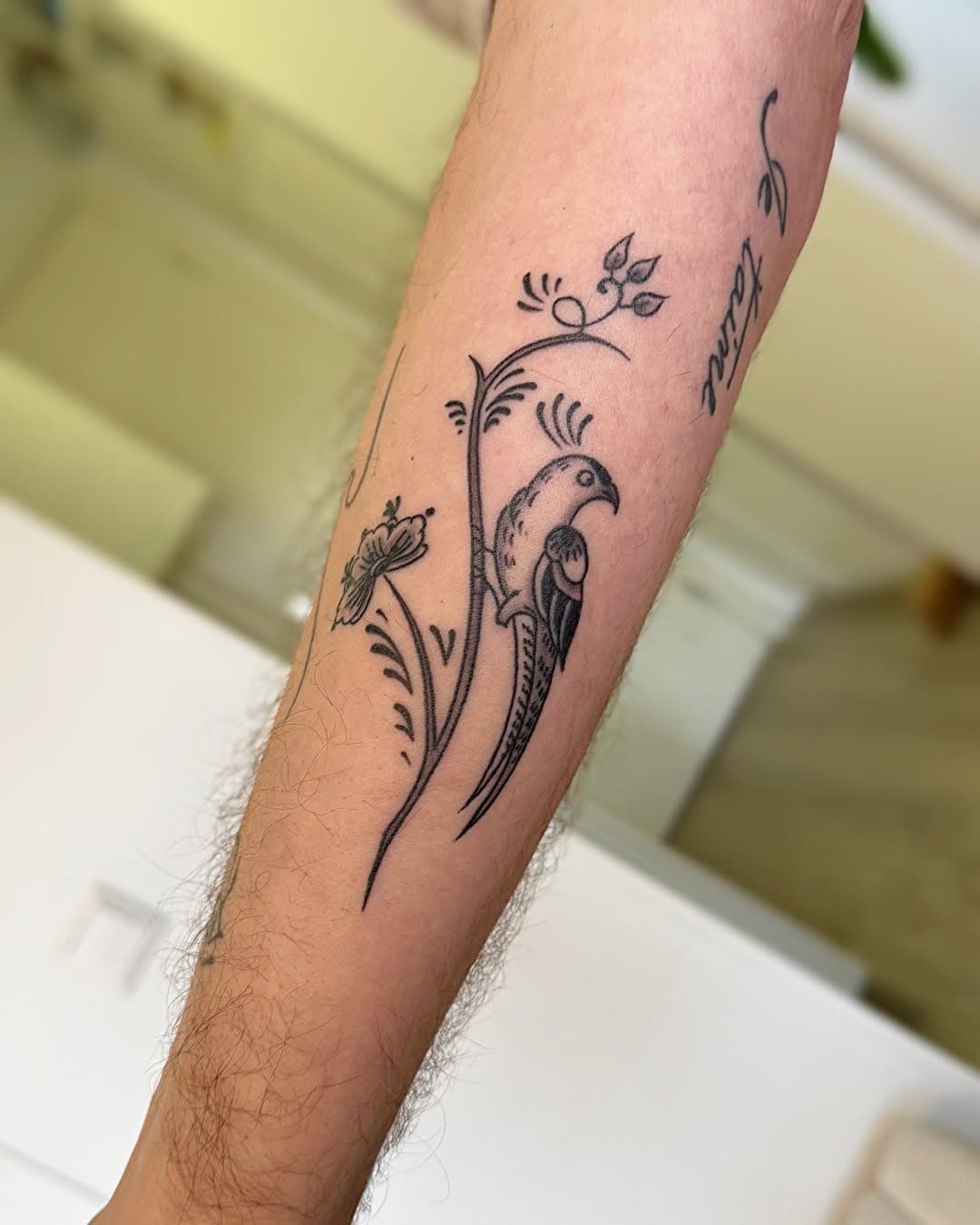 Delft Blue tattoo, bird botanical forearm