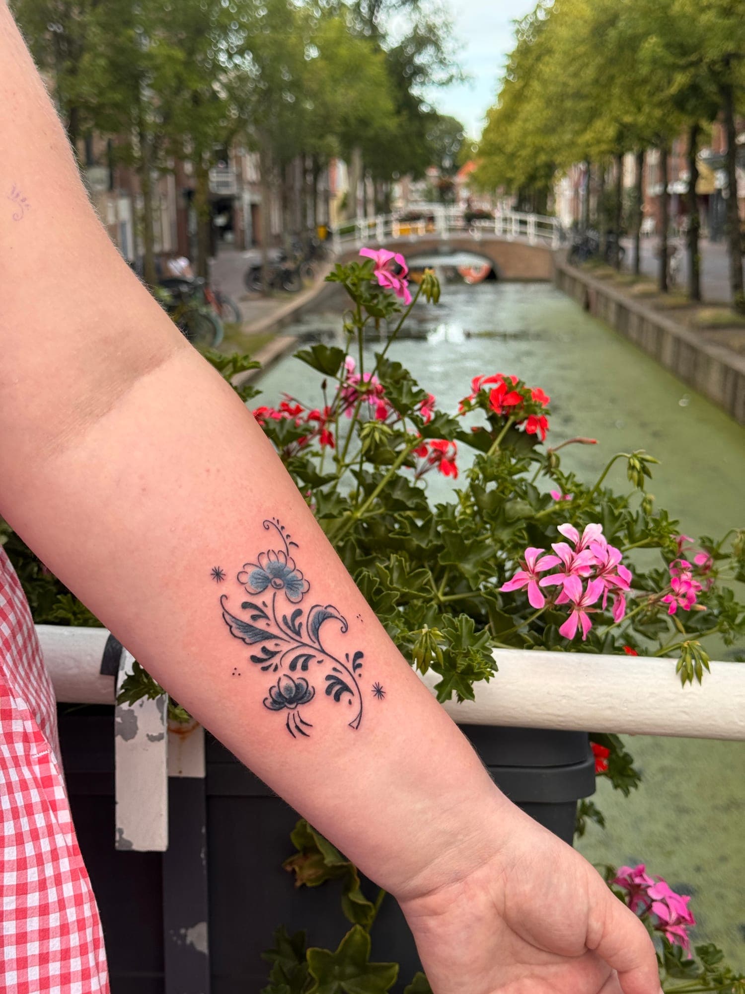 Delft Blue tattoo, floral forearm