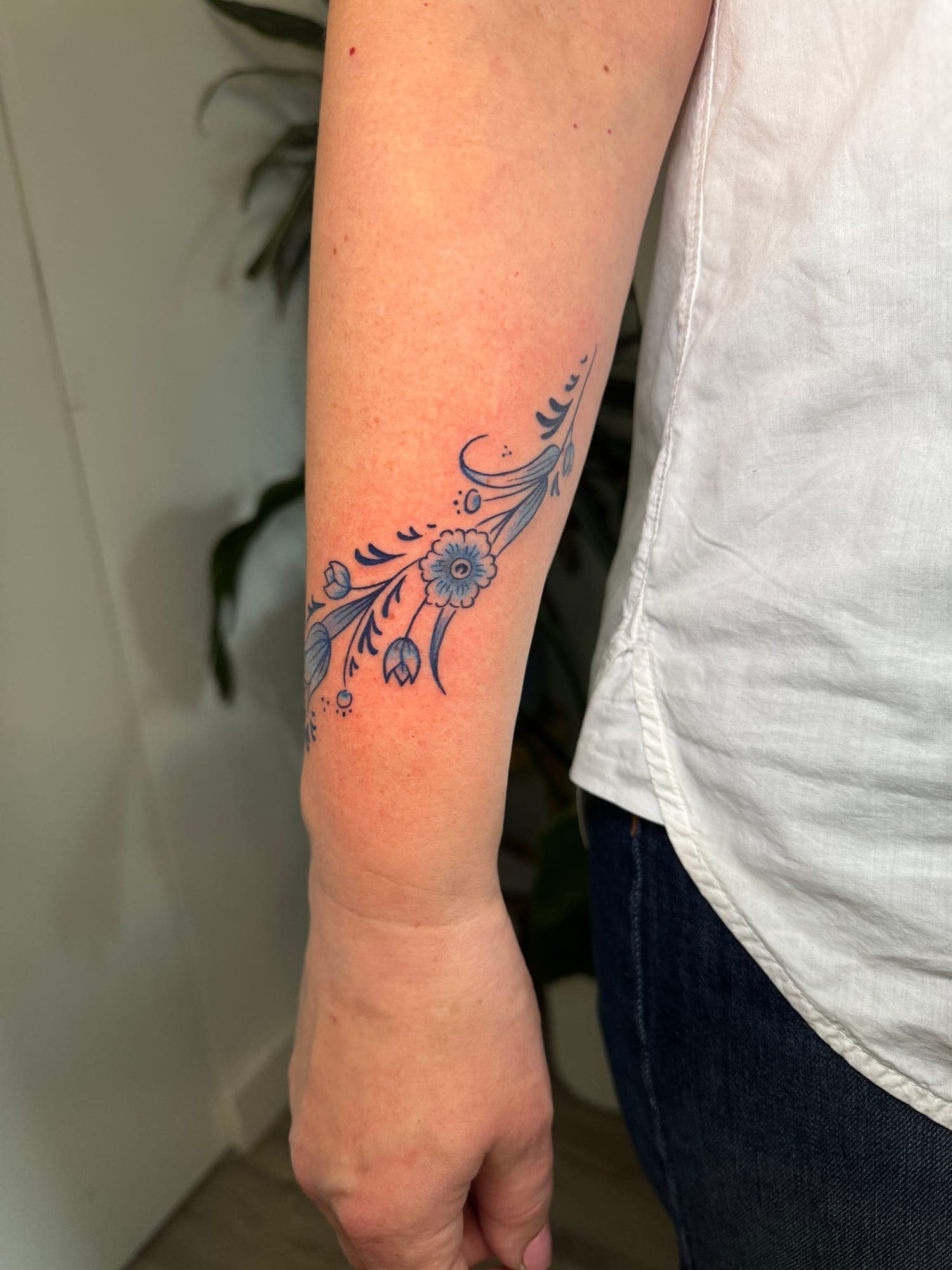 Delft Blue tattoo, floral forearm