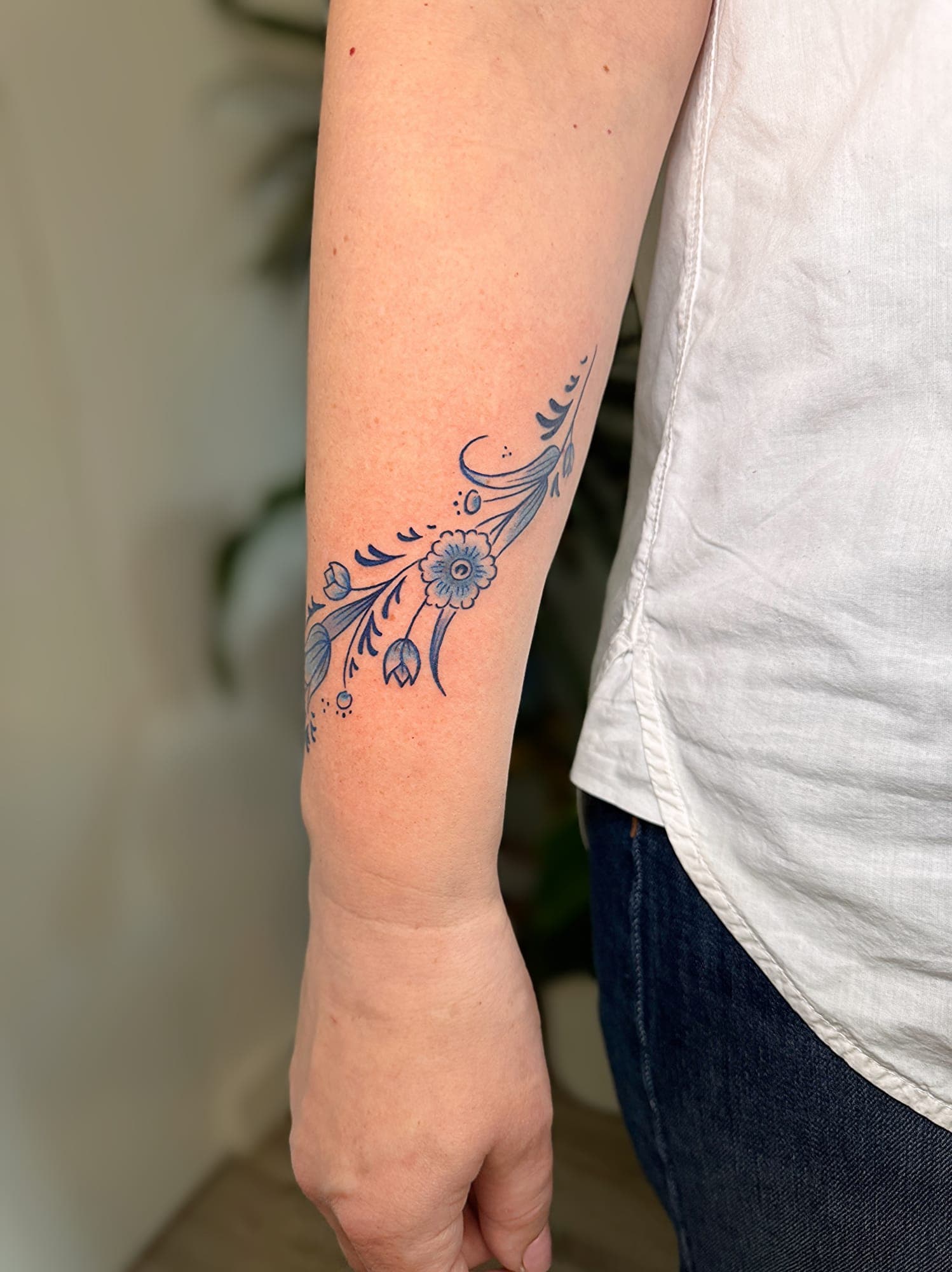 Delft Blue tattoo, small floral forearm