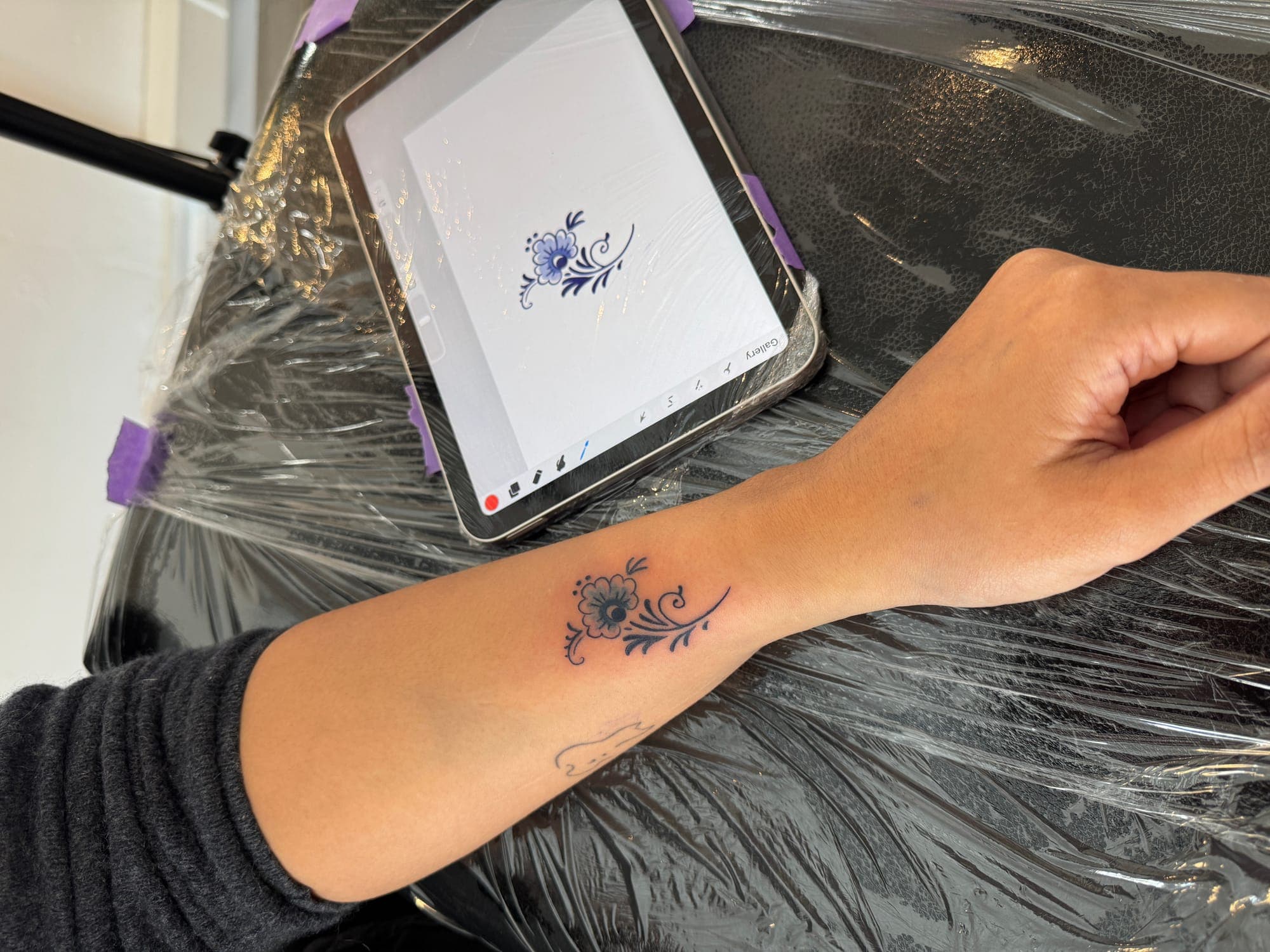 Delft Blue tattoo, small flower wrist