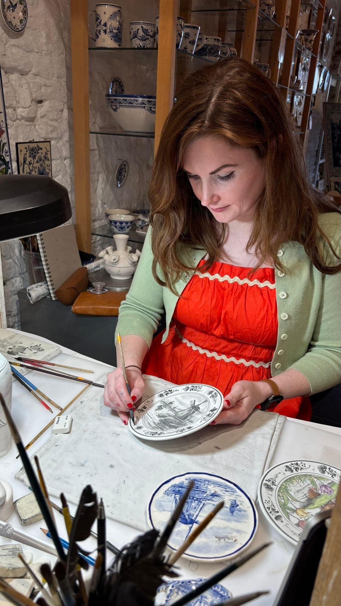 Lydia hand-painting Delft Blue pottery