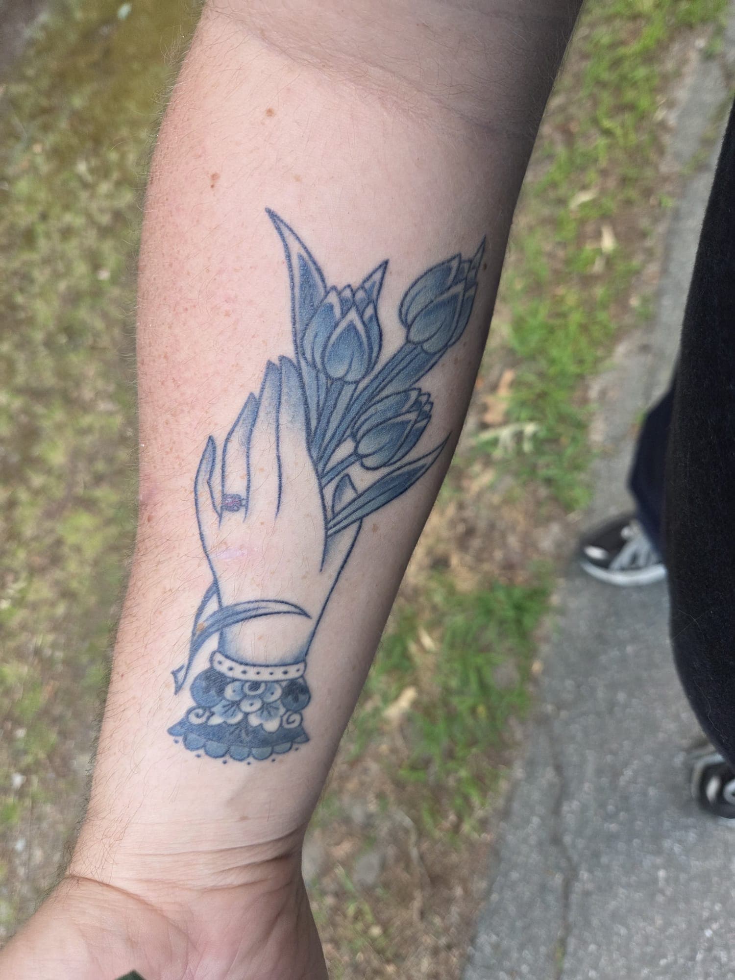 Healed Delft Blue tattoo, cat floral forearm