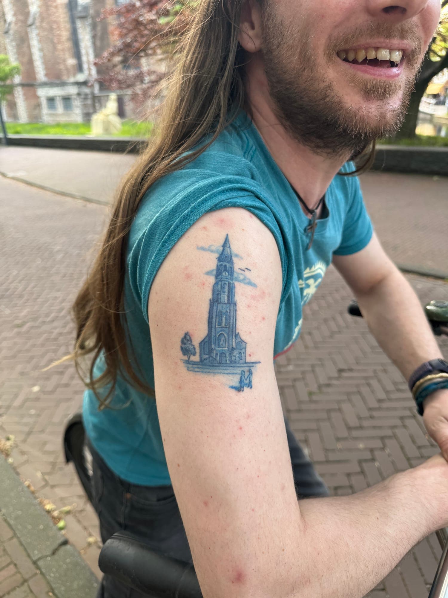 Healed Delft Blue tattoo, dutch building upper arm