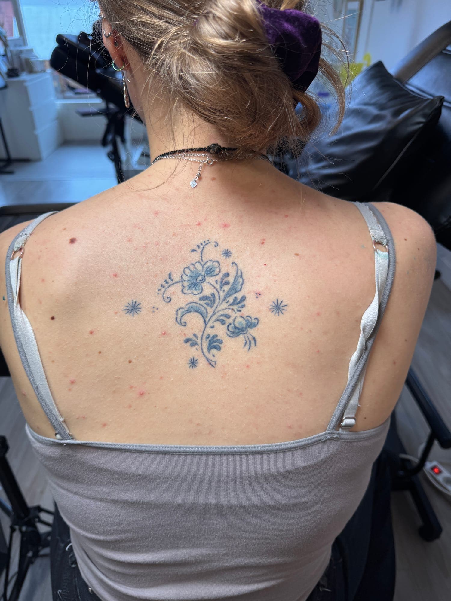 Healed Delft Blue tattoo, floral back