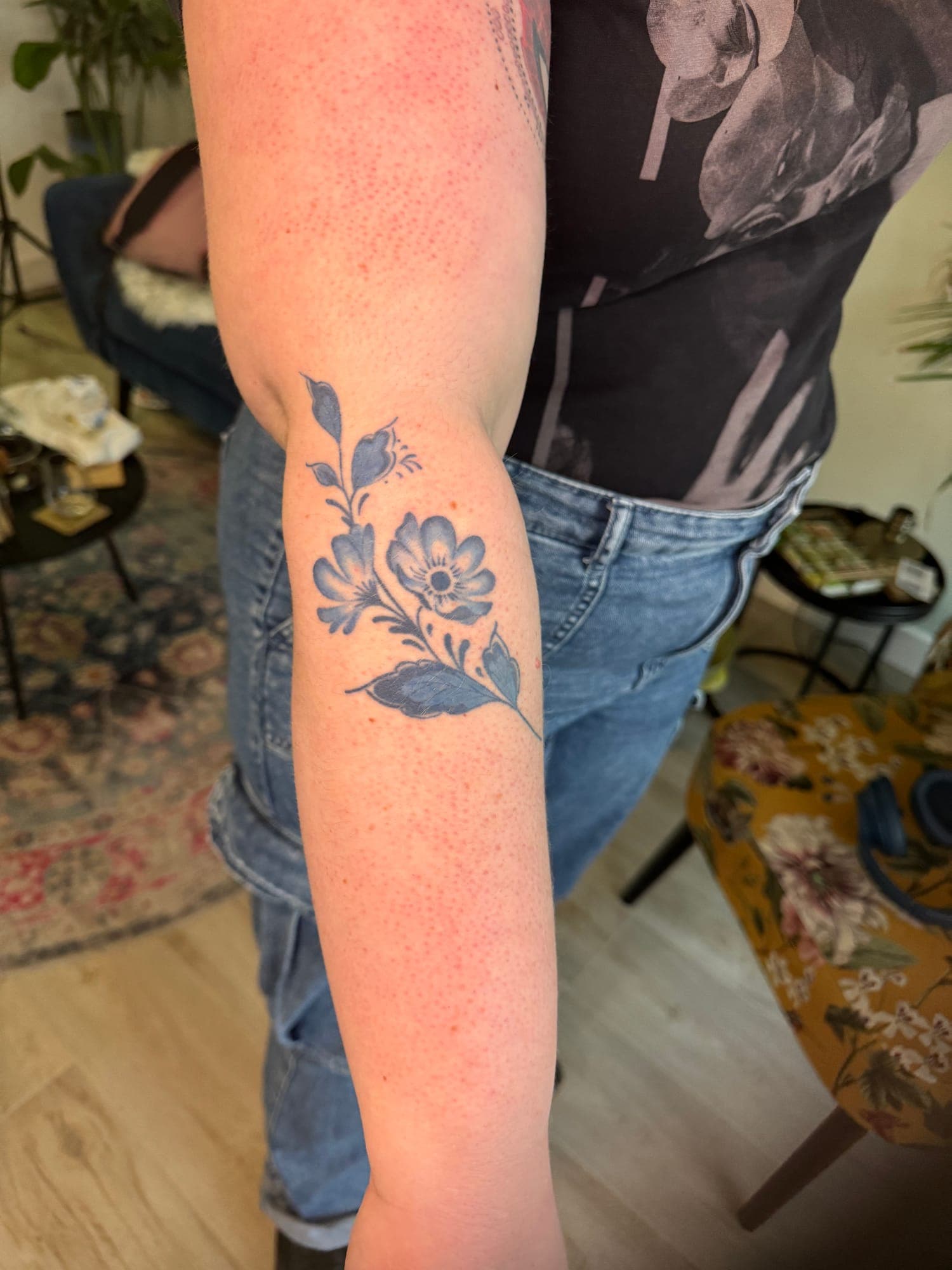 Healed Delft Blue tattoo, floral forearm