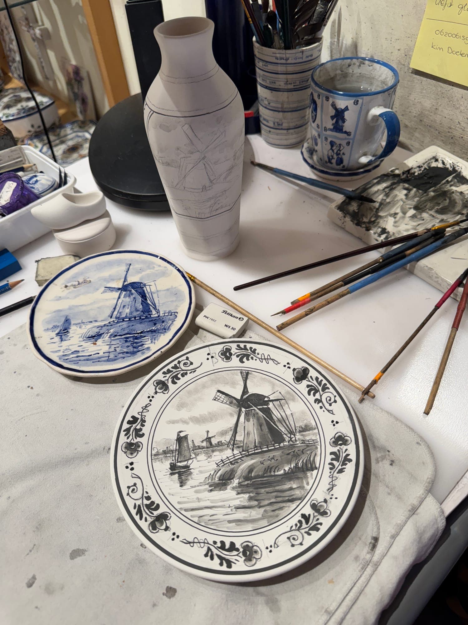 Delft Blue windmill plates being painted